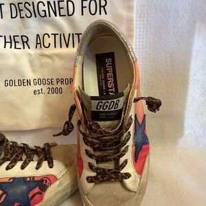 Golden Goose low-top sneakers in white, pink and blue with graffiti star